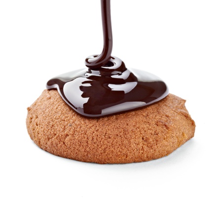 close up of a chocolate syrup on a cake on white background の写真素材