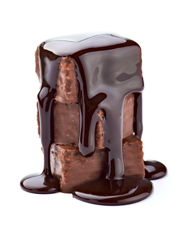 close up of a chocolate syrup on a cake on white background の写真素材