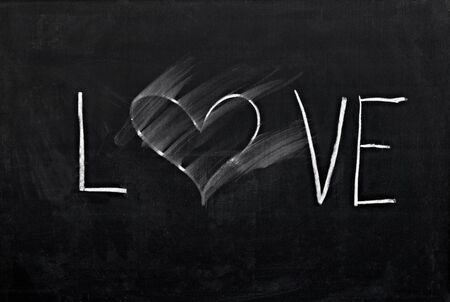 smudge erased heart on chalkboard の写真素材