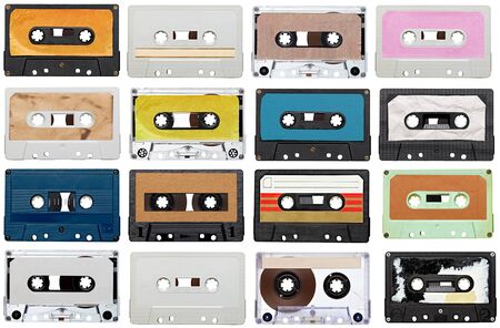 collection of various vintage audio tapes on white の写真素材