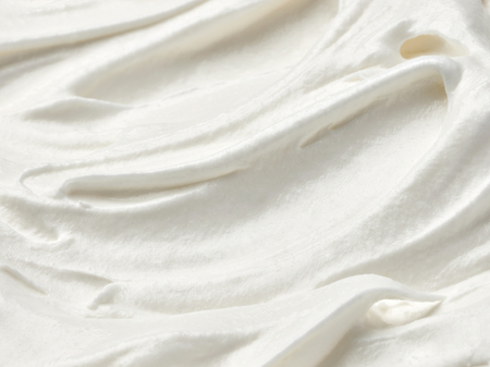 close up of  a white whipped or sour cream on white backgroundの写真素材
