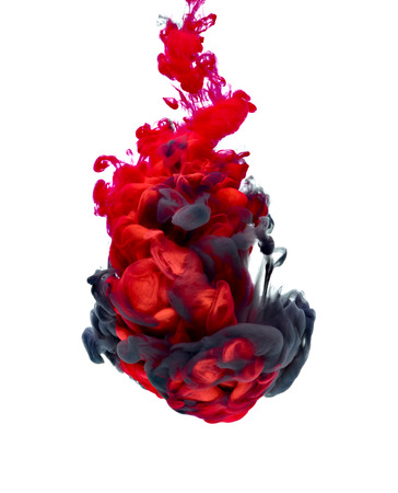 red and black paint in waterの写真素材