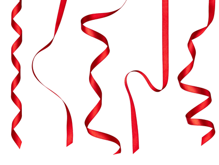 collection of  various red ribbon pieces on white background. each one is shot separatelyの写真素材