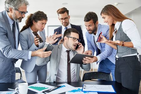 businessman overwhelmed with work stressed in the office