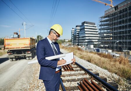 senior businessman architect on the construction site