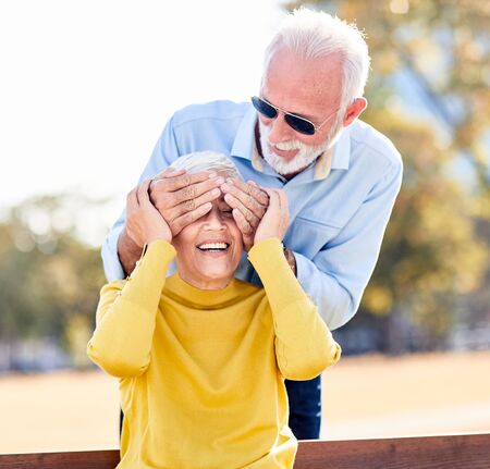portrait of happy smiling senior couple outdoorsの写真素材