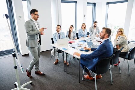 group of young business people having a meeting in the office