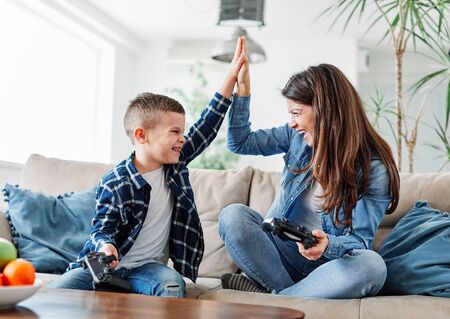 mother and son playing and having fun at home