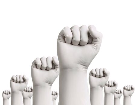close up of a hand fist with blue latex protective gloves on white backgroundの写真素材