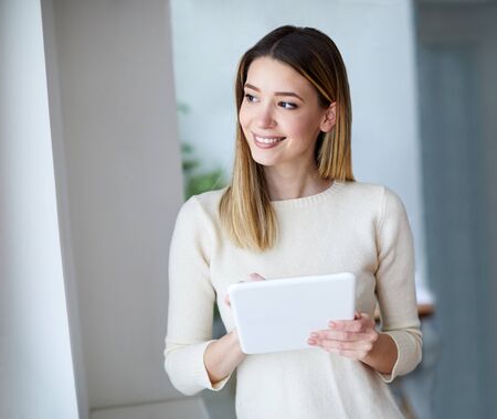 portrait of a young girl using a tablet