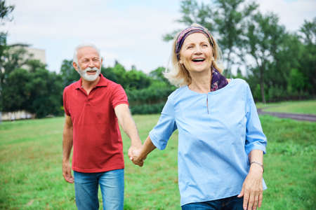 portrait of happy smiling senior couple outdoors