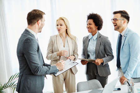 Group of young business people having a meeting in the office. Teamwork and success conceptの写真素材