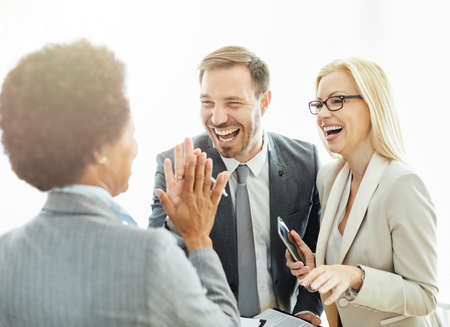 Group of young business people having a meeting in the office. Teamwork and success conceptの写真素材