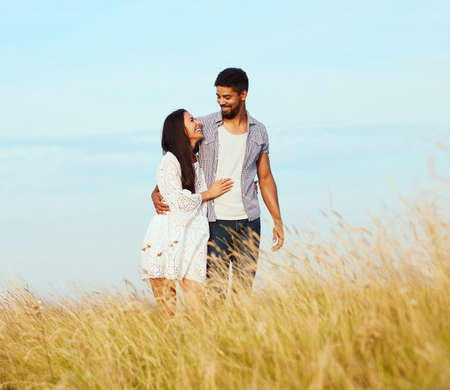 Portrait of a lovely young couple together outdoorsの写真素材