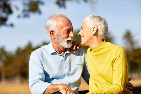 portrait of happy smiling senior couple outdoors