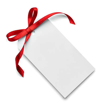 close up of a note card with red ribbon bow on white backgroundの写真素材