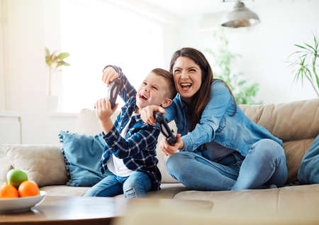 mother and son playing and having fun at home