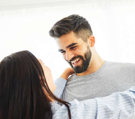 Portrait of a lovely young couple together at homeの写真素材