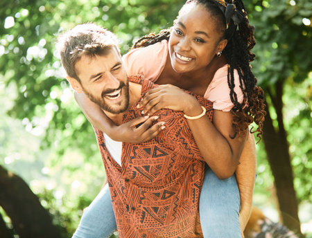Young couple having fun outdoors in a parkの写真素材