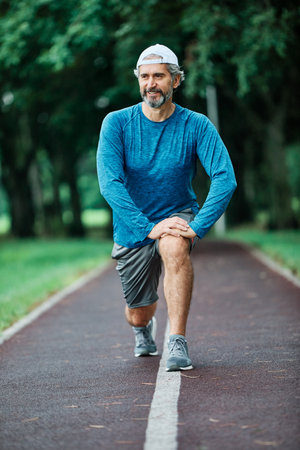 portrait of a senior man exercising and running outdoors
