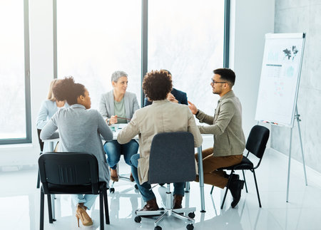 Group of young business people having a meeting or presentation and seminar with whiteboard in the officeの写真素材
