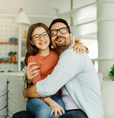 Family father and daughter having fun bonding at homeの写真素材