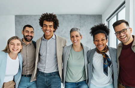 Portrait of a group of young and business people having a meeting in the office. Teamwork and success conceptの写真素材