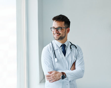 portrait of a young doctor in his office in a hospitalの写真素材