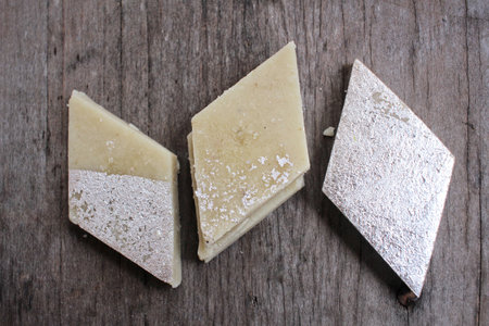 Kaaju Katli, Kaju Burfi, Indian sweet made of cashews with silver  foiling decorated in a platter with nice background. Indian Festive foodの写真素材