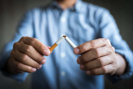 Male hand crushing cigarette.Quitting from addiction concept.の写真素材