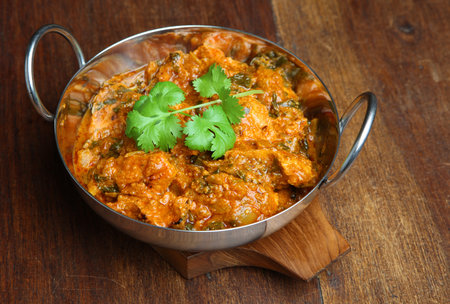Indian chicken saag masala curry in balti dishの写真素材