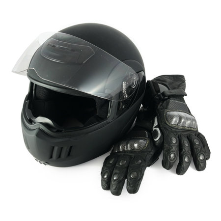 "Black, glossy motorcycle helmet and leather gloves with carbon fiber protection"の写真素材