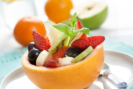 fruity salad in ripe grapefruit. shallow dofの写真素材