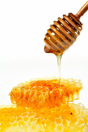 golden honey pouringの写真素材