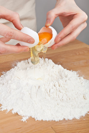 Breaking Eggs for the Doughの写真素材