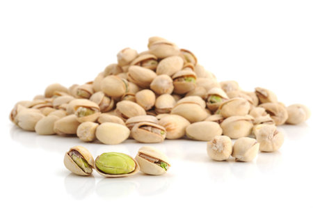Extreme close-up image of pistachios on white backgroundの写真素材