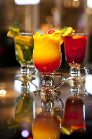 Colorful cocktails on the bar counter in the night club. Cocktails in the bar.の写真素材