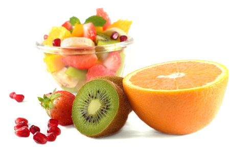 Healthy fruit salads with fruits on frontの写真素材