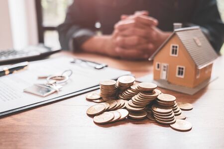 Saving money to invest in house or property in the future. Business Finance Concept.の写真素材