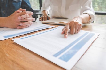 Business team brainstorming and discussing with financial data and report graph. Teamwork meeting working concept.の写真素材