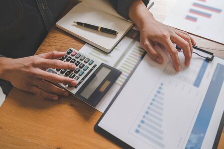 Business team brainstorming and discussing with financial data and report graph. Teamwork meeting working concept.の写真素材