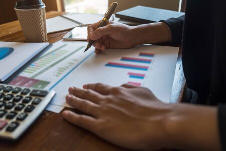 Business team brainstorming and discussing with financial data and report graph. Teamwork meeting working concept.の写真素材