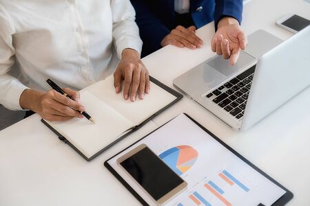 Business team brainstorming and discussing with financial data and report graph. Teamwork meeting...