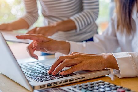 Business team brainstorming and discussing with financial data and report graph. Teamwork meeting working concept.の写真素材