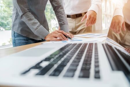 Business team brainstorming and discussing with financial data and report graph. Teamwork meeting working concept.の写真素材