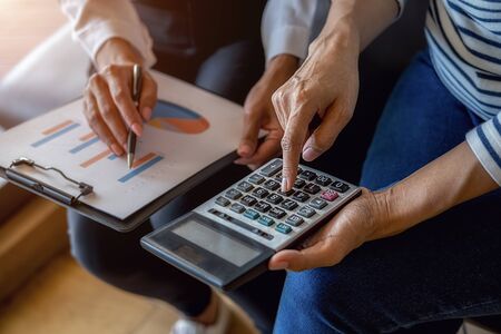 Business team brainstorming and discussing with financial data and report graph. Teamwork meeting working concept.の写真素材