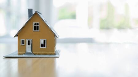House model on wooden table.の写真素材