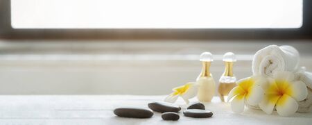 Spa treatment concept. Spa background with spa accessories on white bathroom background.の写真素材