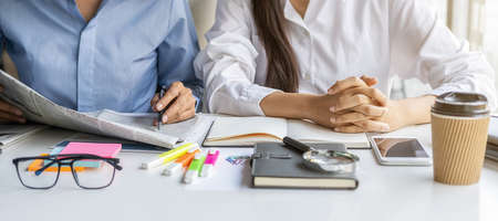 Young unemployed is searching for a job in the newspaper and laptop. Interview the job and hiring...