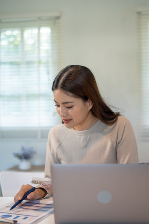 Lovely mom and little young daughter spending time together in their living room.の写真素材
